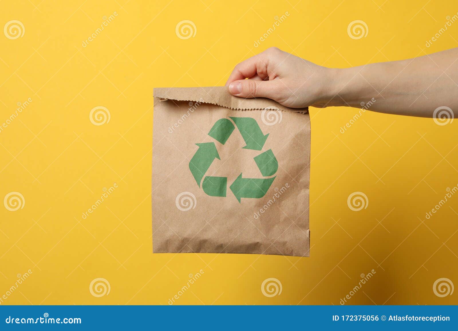 Download Hand Holding Paper Bag With Recycle Sign On Yellow Background Stock Photo Image Of Brown Idea 172375056 Yellowimages Mockups