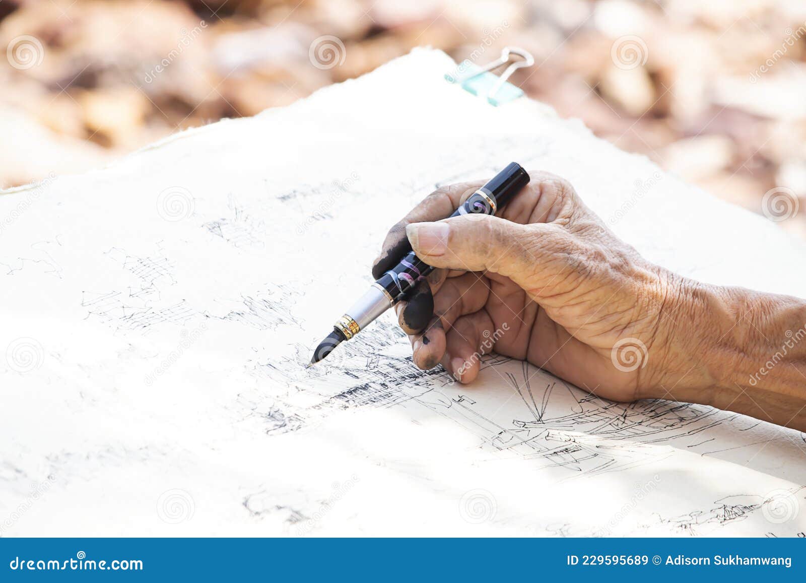 Hand Holding Pen Drawing on Paper Stock Image Image of sign, plan