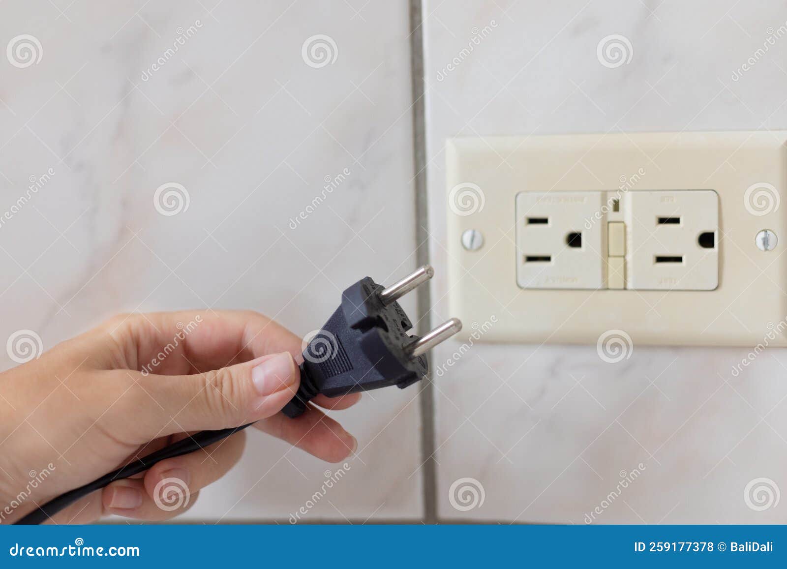 Hand Holding Power Cable Which Doesnt Feet To the Electrical Plug Type