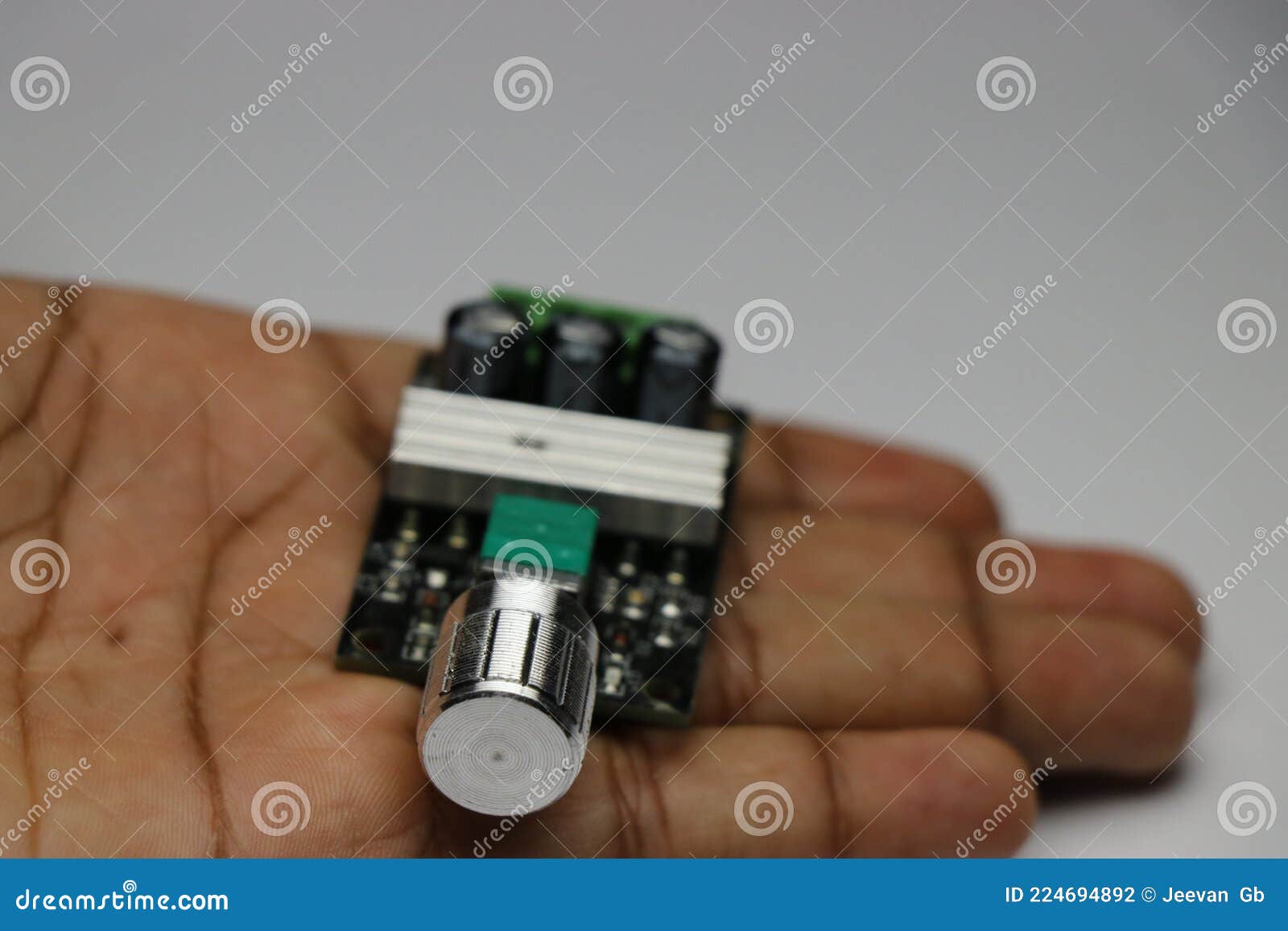 hand holding pulse width modulation speed controller board module for dc motor
