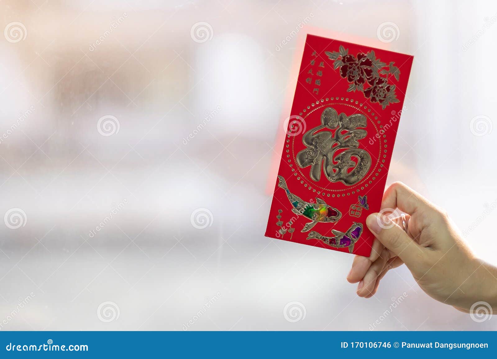 Hand Holding Angpao Money On Envelope Chinese New Year Celebrate