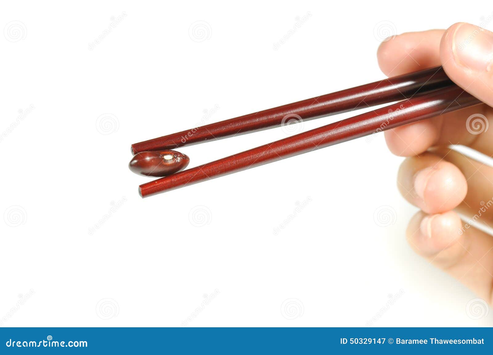 Hand Holding Red Kidney Bean With Chopsticks Isolated. Stock Image