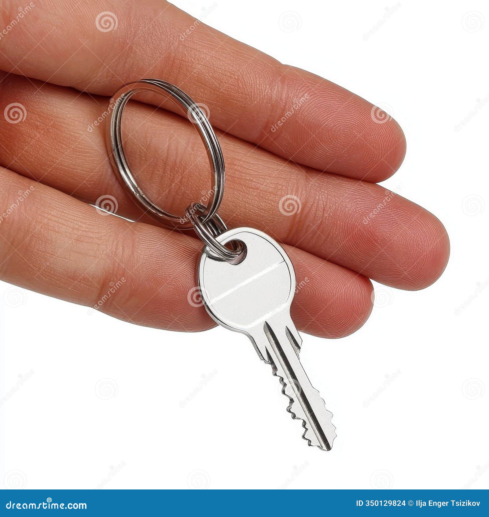 hand holding a single key on a ring chain,  on white background with blurred background.