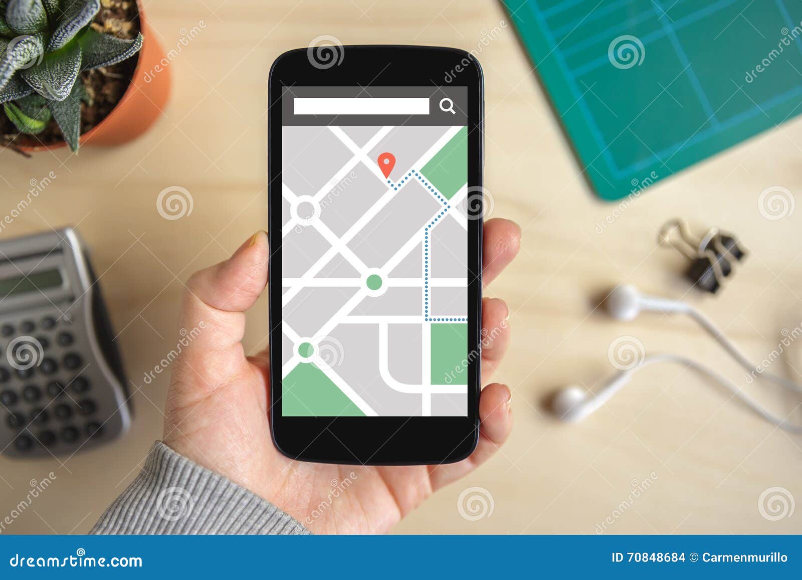 hand holding smart phone with map gps navigation application on