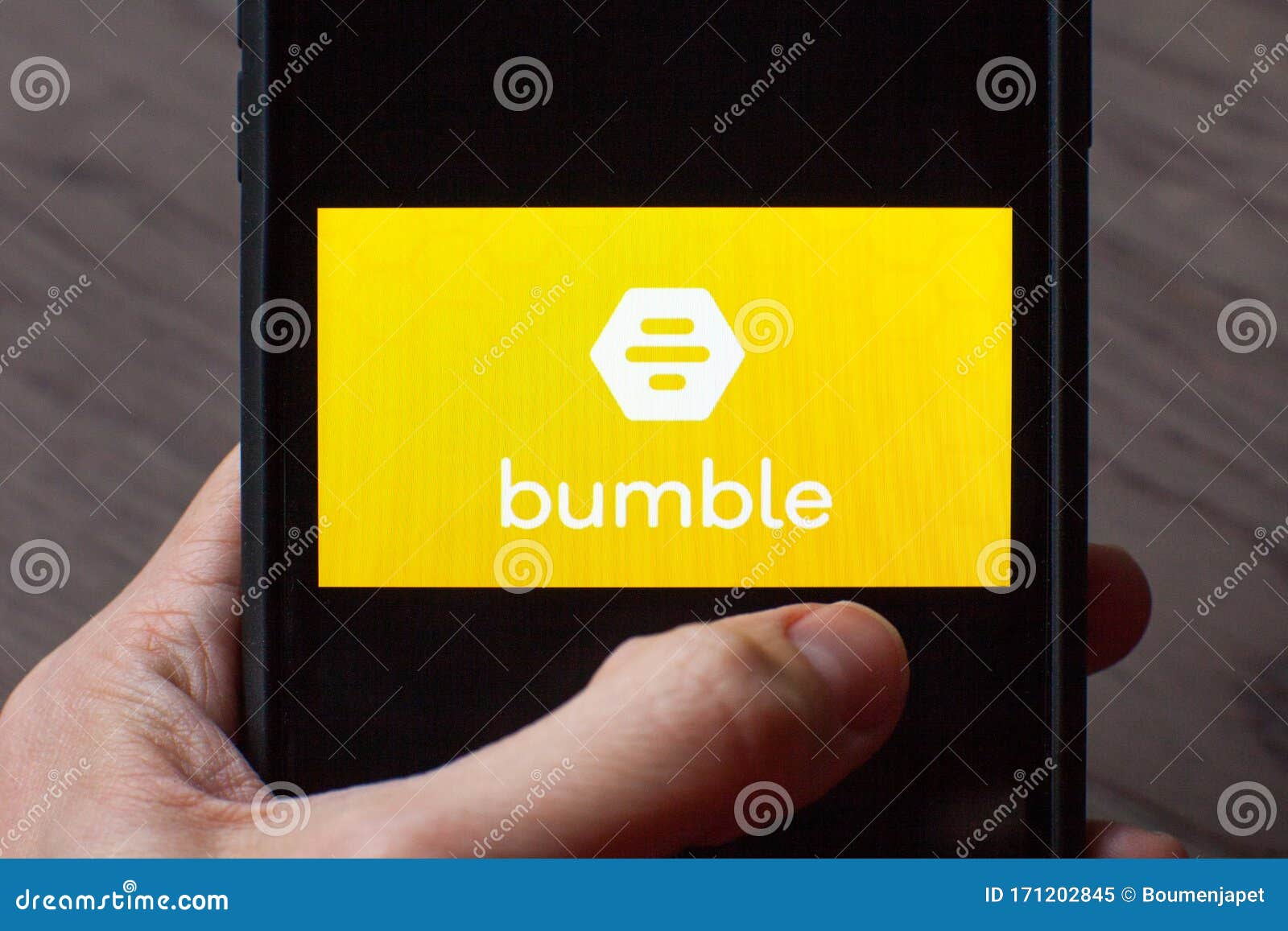 Hand Holding A Smartphone With A Bumble Dating Icon On Screen Editorial Image Image Of Concept Couples