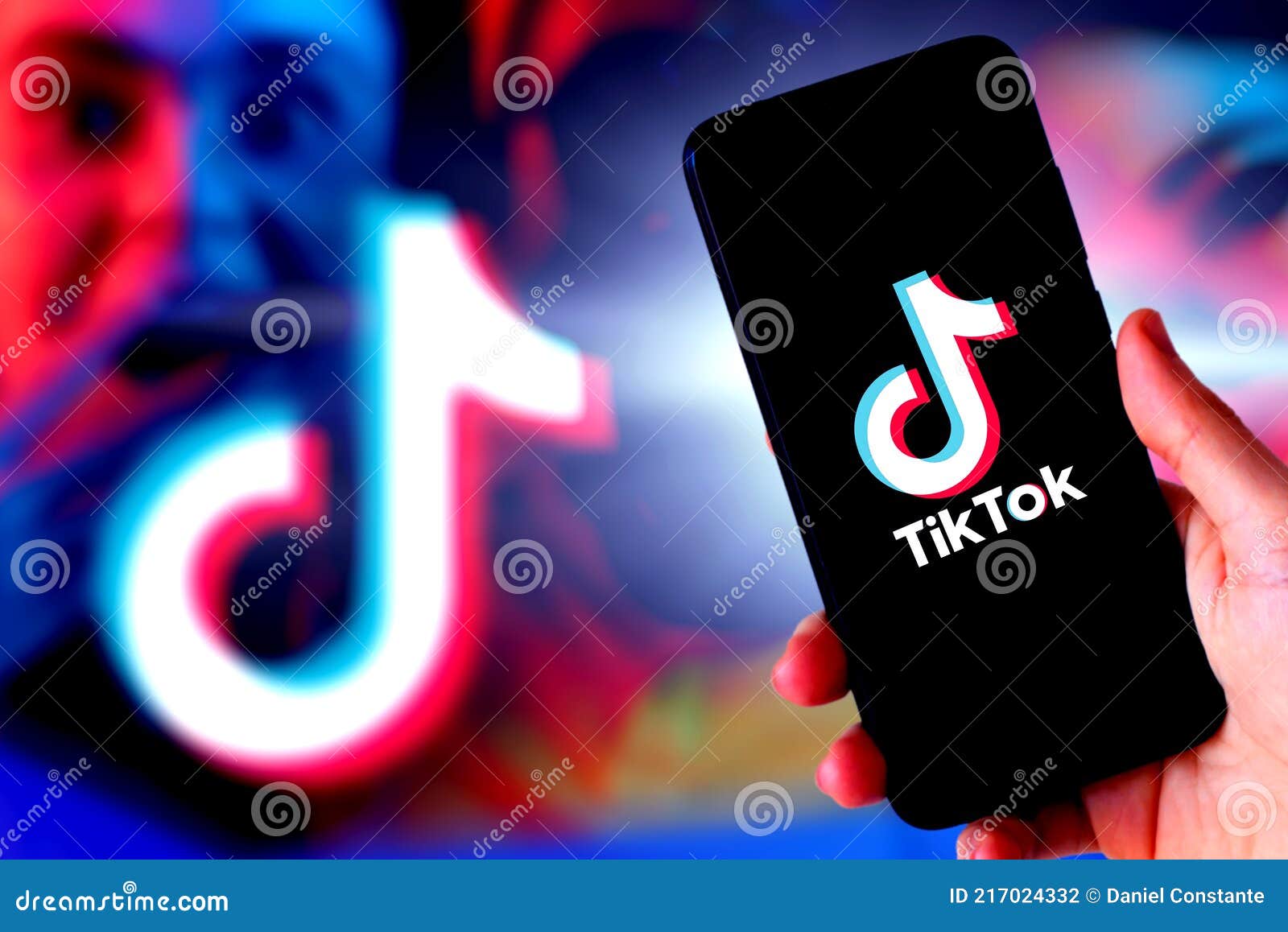Hand Holding a Smartphone with TIK TOK Logo Editorial Photography