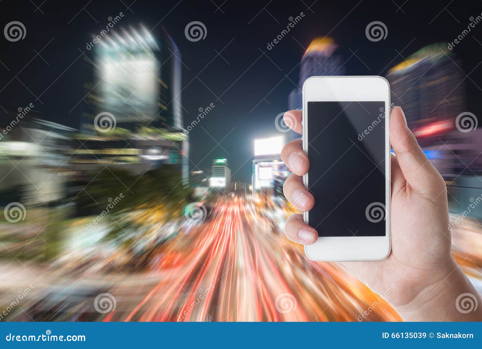 Hand Holding Smartphone with Traffic Jam in the City Stock Image