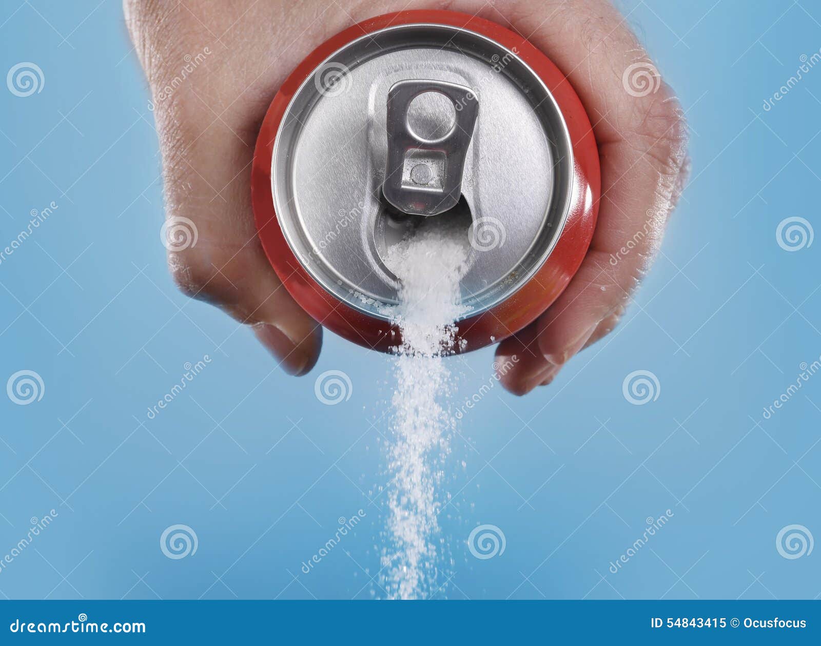 hand holding soda can pouring a crazy amount of sugar in metaphor of sugar content of a refresh drink