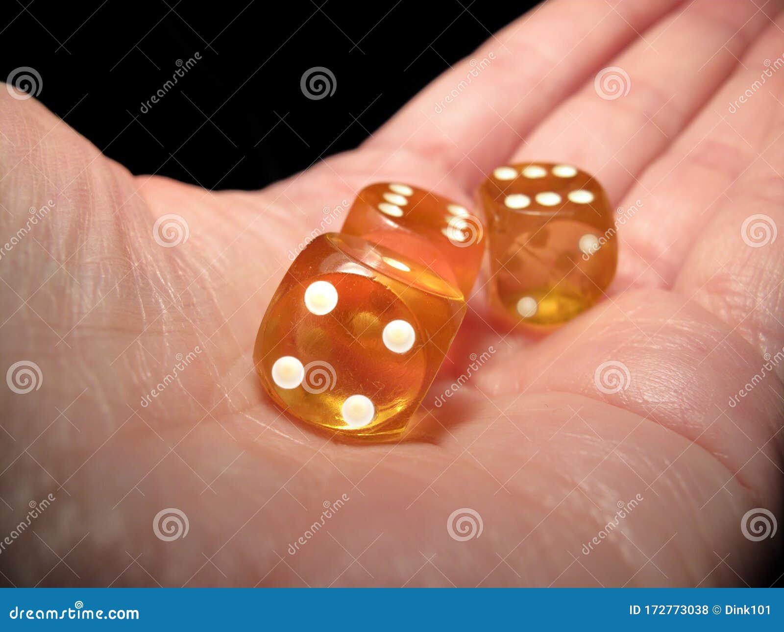 Hand Holding Three Dice on a Black Background Stock Photo Image of