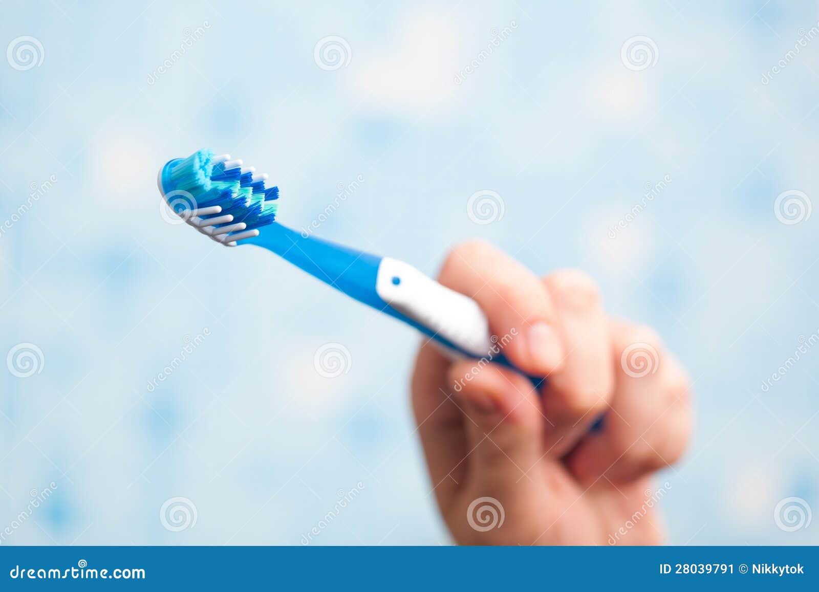 Hand holding toothbrush stock image. Image of dental 28039791