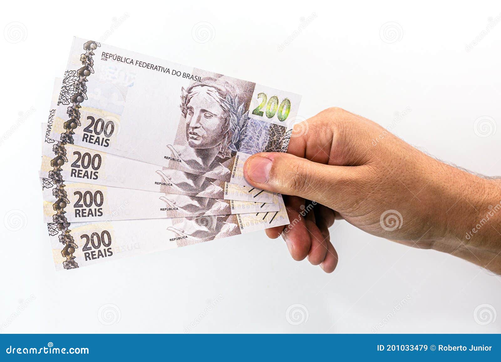 hand holding two hundred reais bank notes, brazil money, payment concept, grand prize or profit