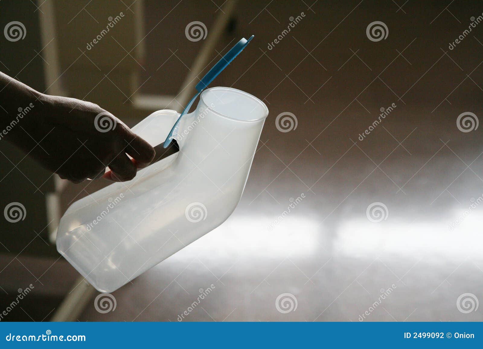 Hand holding a urinal stock photo. Image of hold, portable 2499092