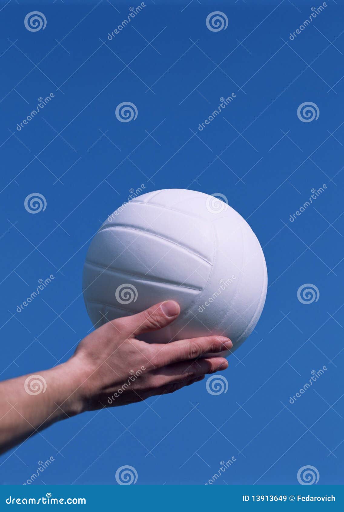 Hand holding a volleyball stock image. Image of game 13913649