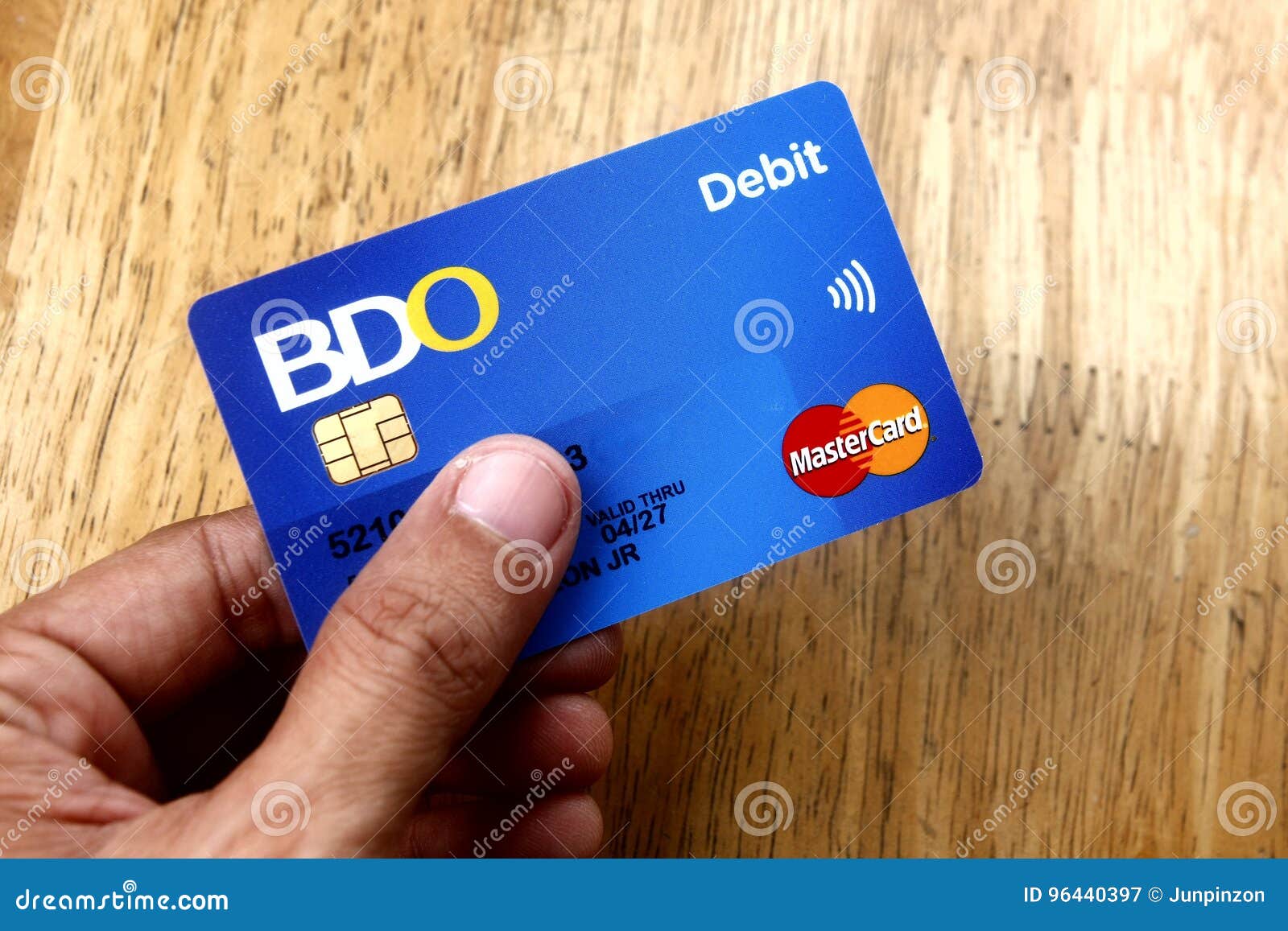 a-hand-holds-a-bdo-debit-mastercard-editorial-photo-cartoondealer