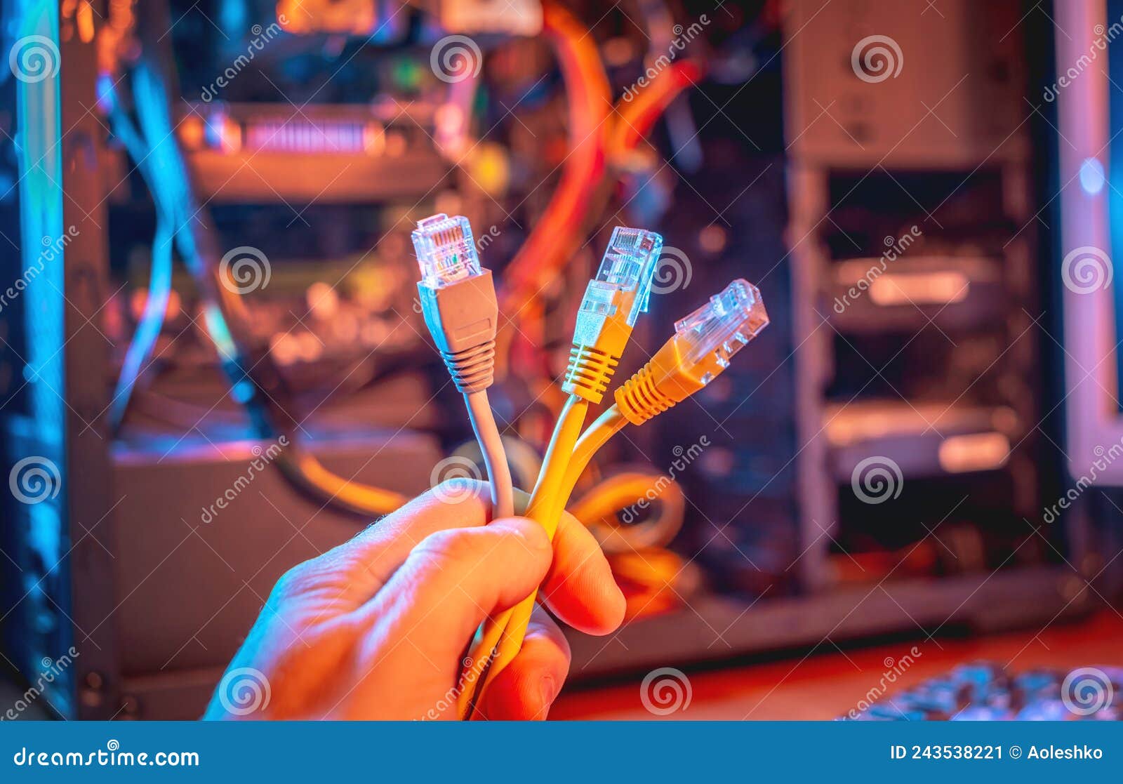 The Hand Holds a Bundle of Cables. Concept of Disconnecting