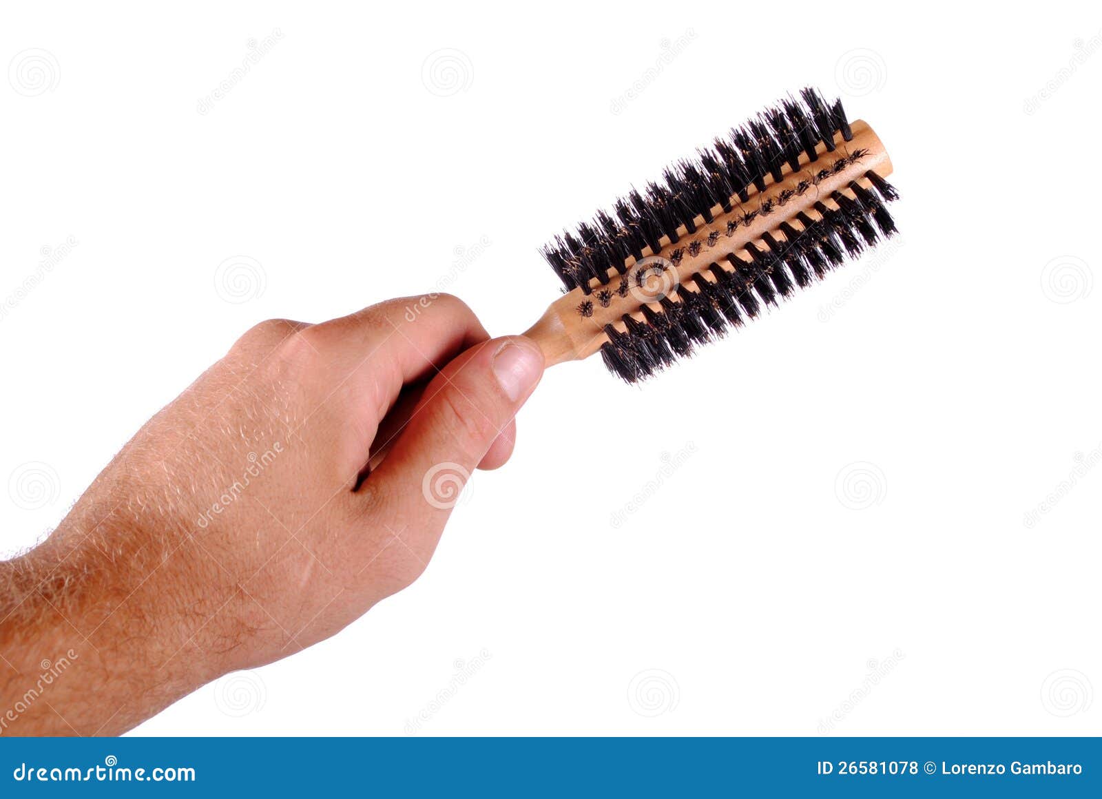 Hand holds a hair brush stock photo. Image of studio 26581078