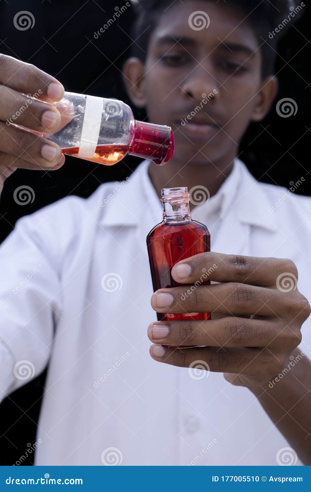 Hand Holds a Test Bottle Containing a Blood Sample, Test Tube with