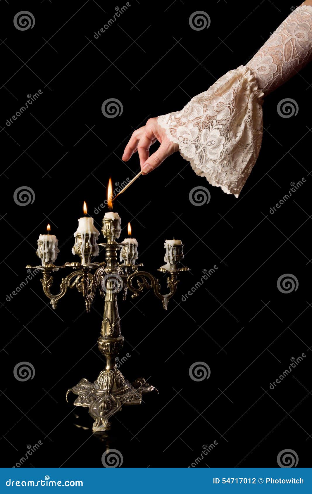 hand igniting candles