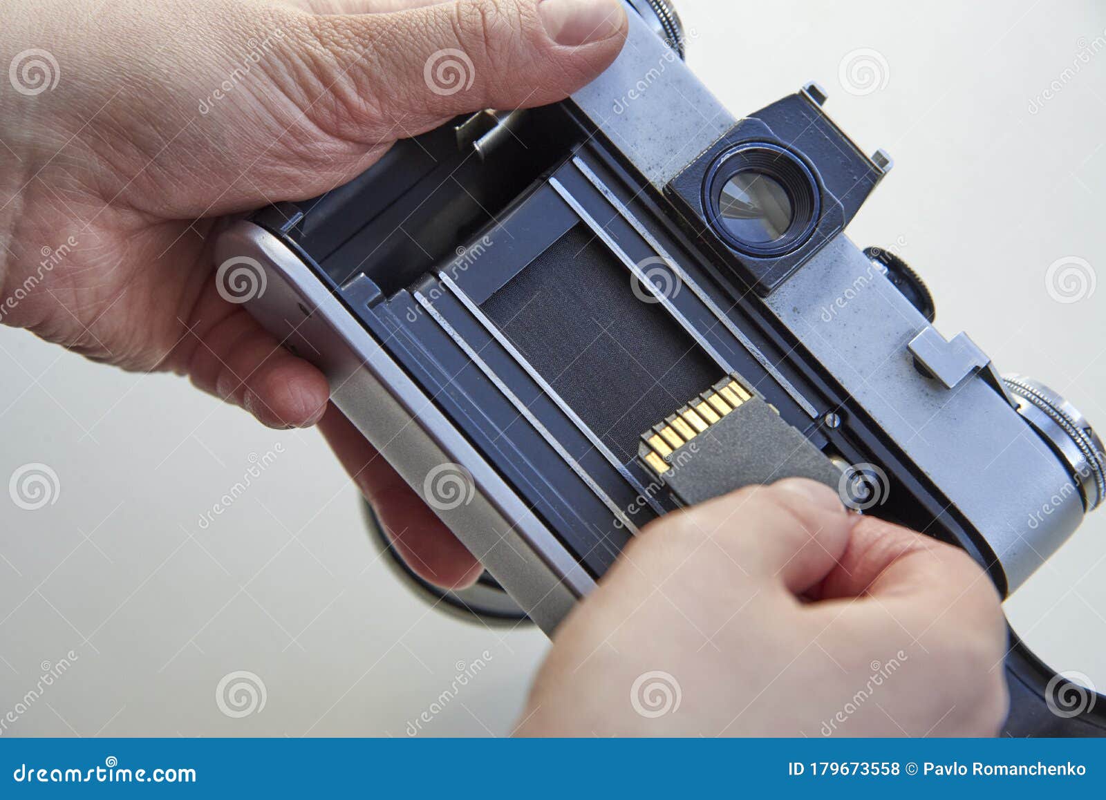The Hand that Inserts the USB Flash Drive into the Film Camera Stock