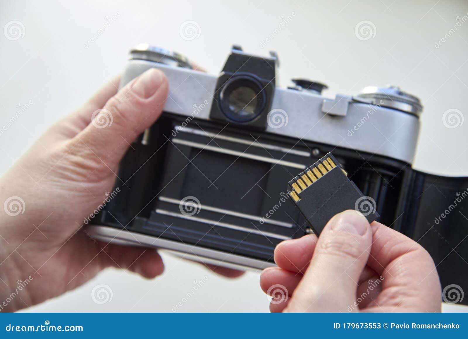 The Hand that Inserts the USB Flash Drive into the Film Camera Stock