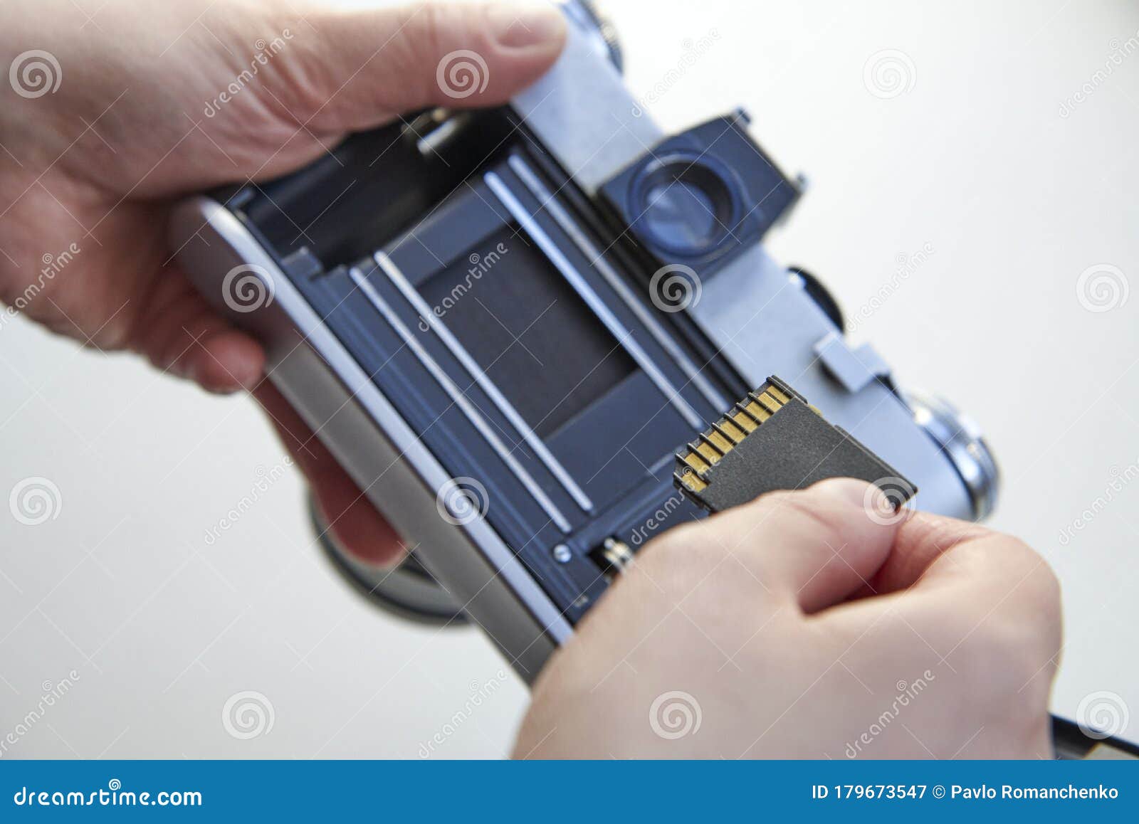 The Hand that Inserts the USB Flash Drive into the Film Camera Stock