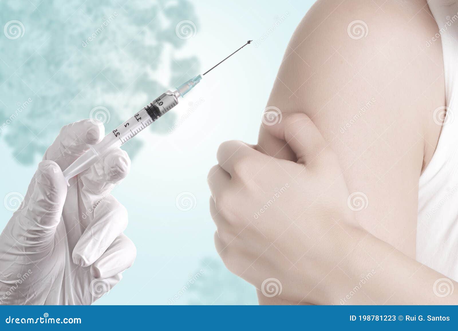 hand holding a syringe with covid-19 vaccine