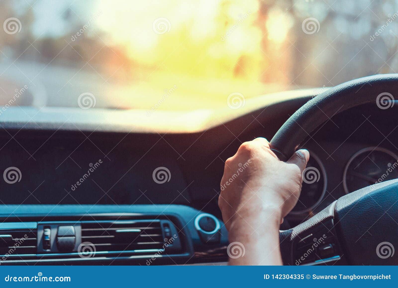 Hand of Man on Steering Wheel Drive a Car with Background Stock Image