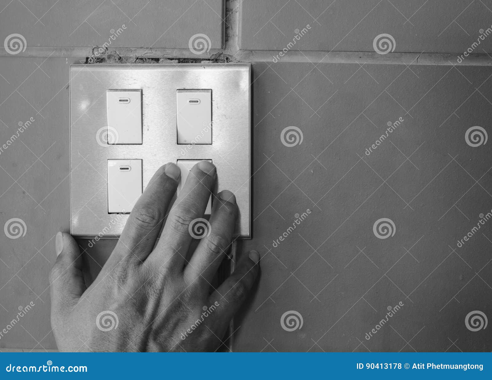 Hand of Man Turn Off the Power Switch on the Wall. Stock Photo