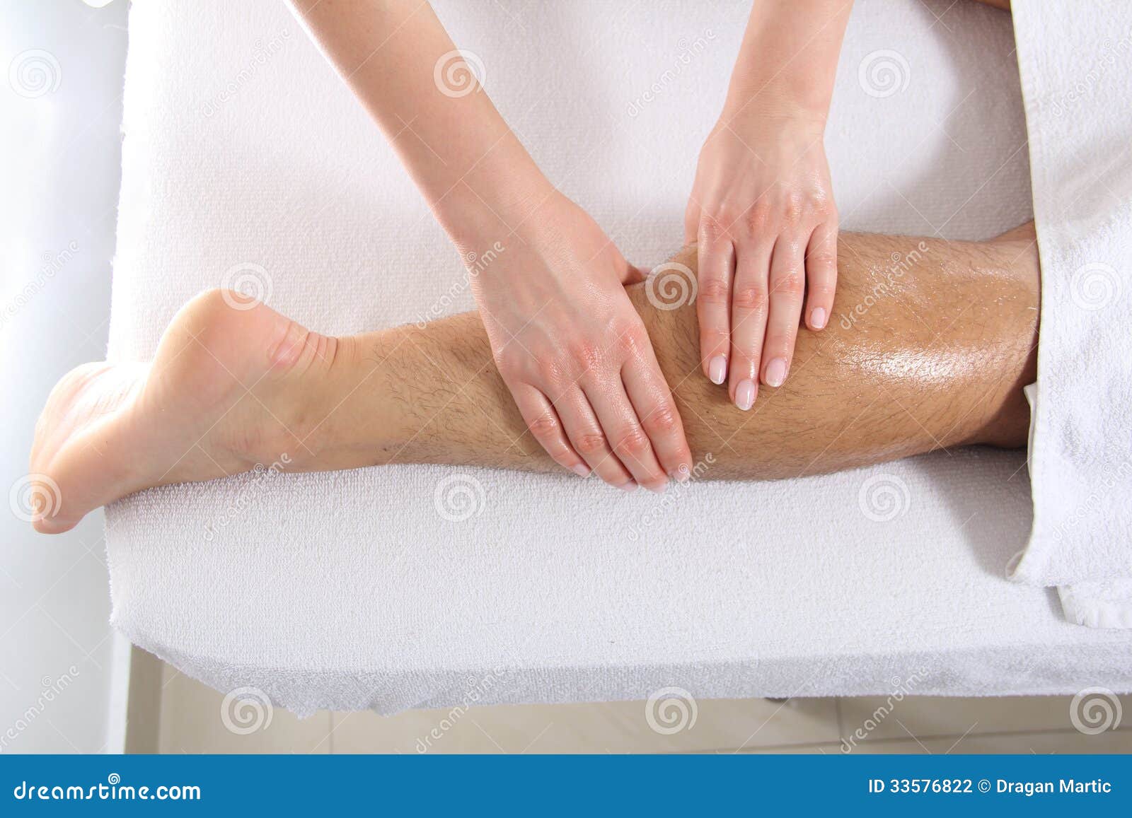 Hand Massaging Leg in Spa stock photo. Image of medicine 33576822