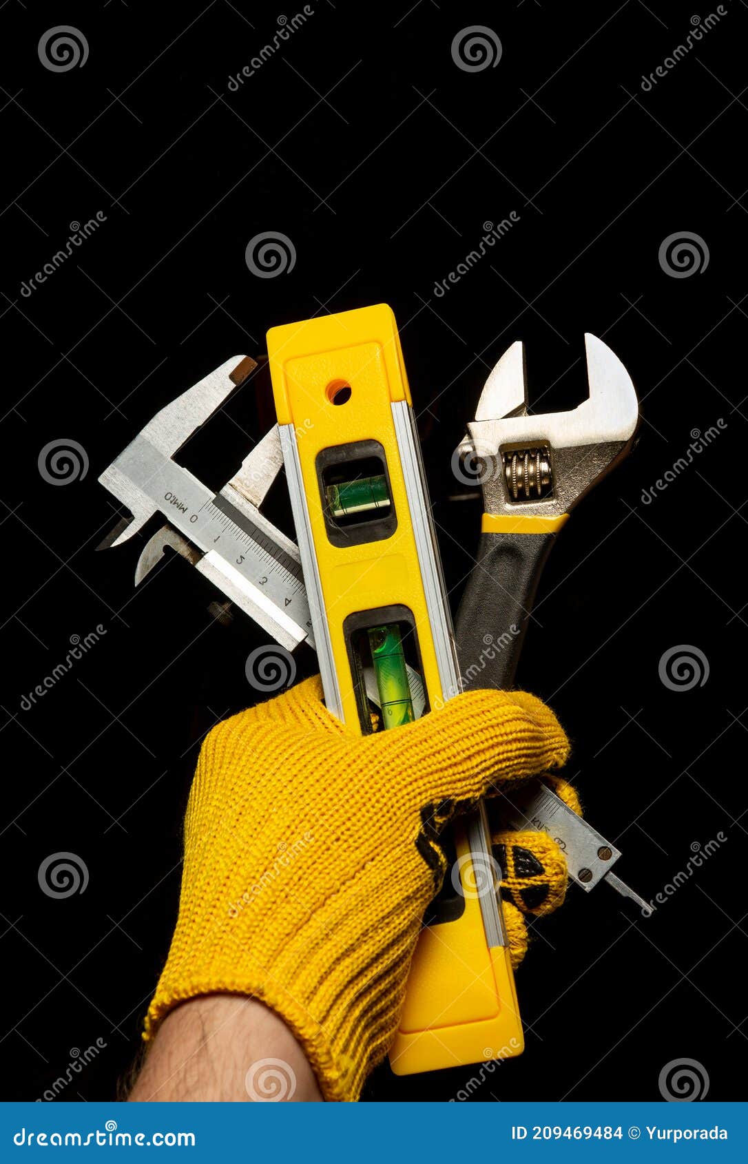 The Hand of the Master Holds a Set of Tools for Repairing or