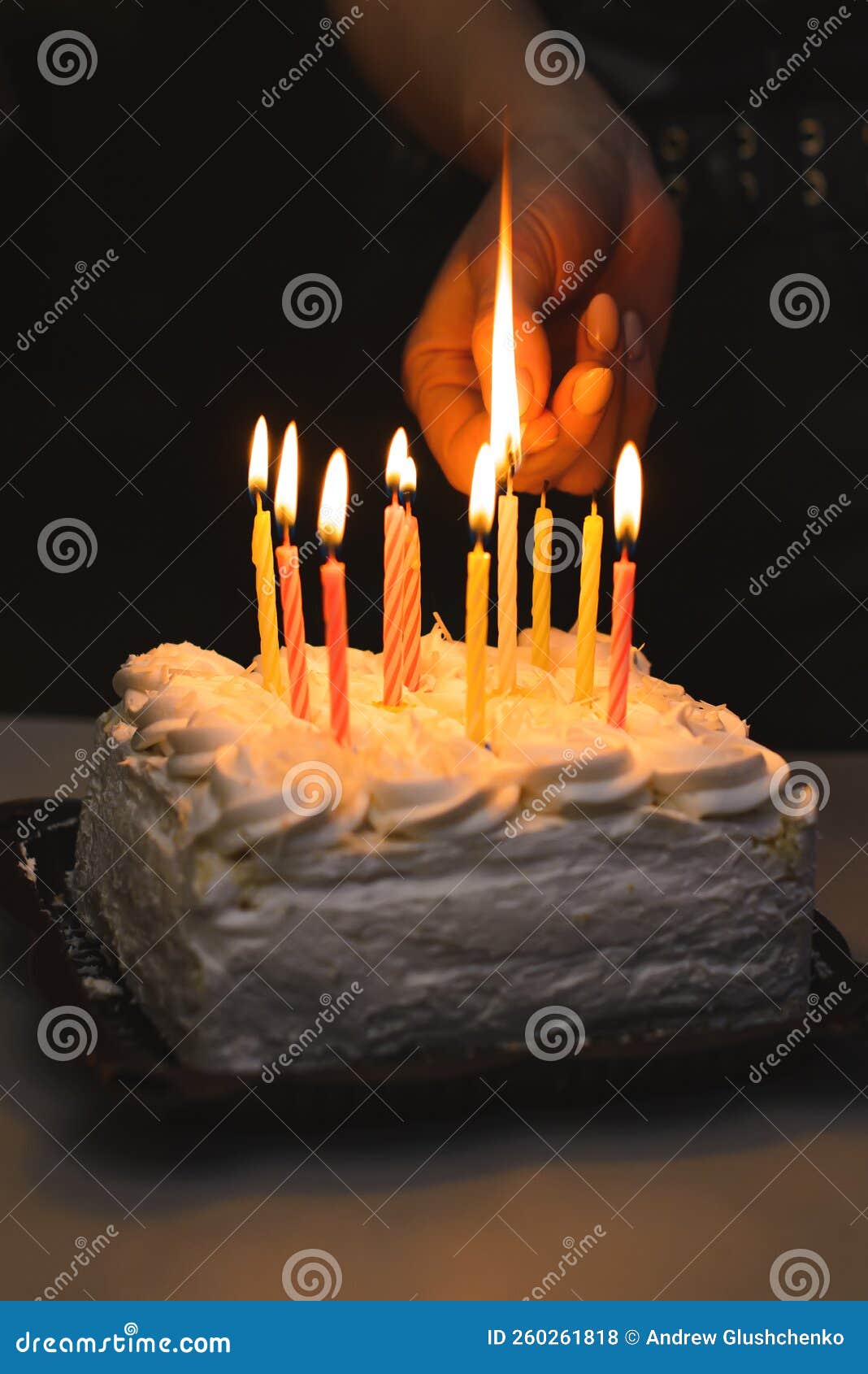 A Hand with a Match Lights Candles on the Cake Stock Photo Image of