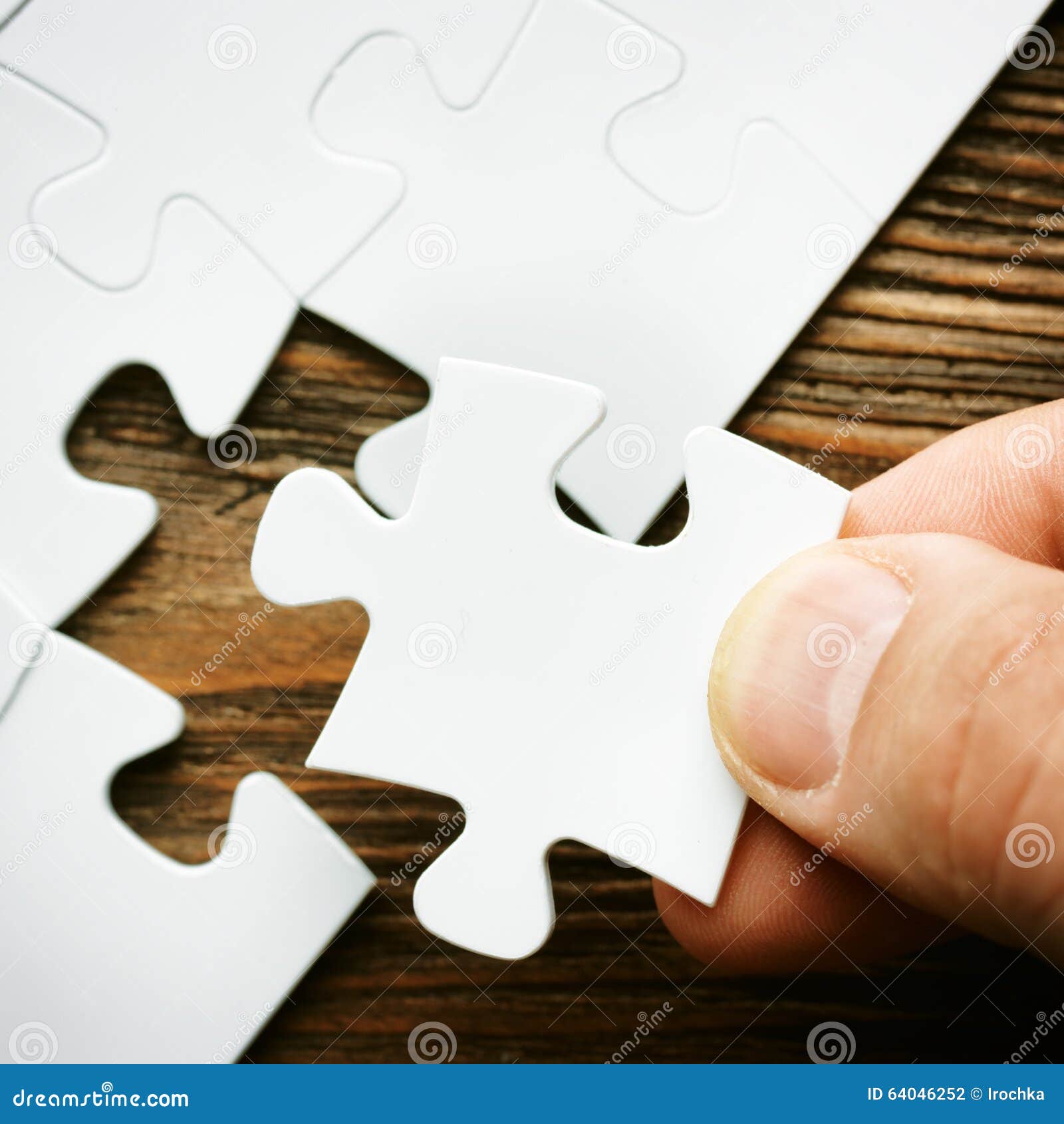 hand with missing jigsaw puzzle piece. business concept image for completing the final puzzle piece.