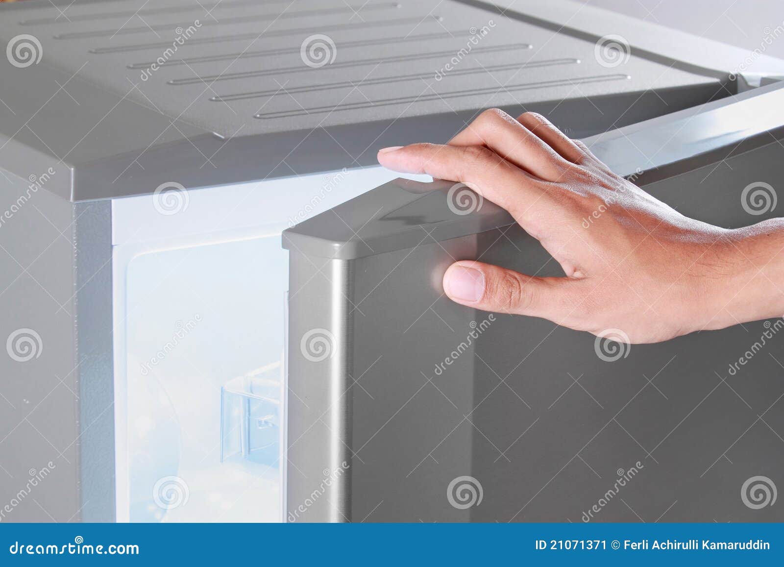 Hand opening refrigerator stock image. Image of clean 21071371