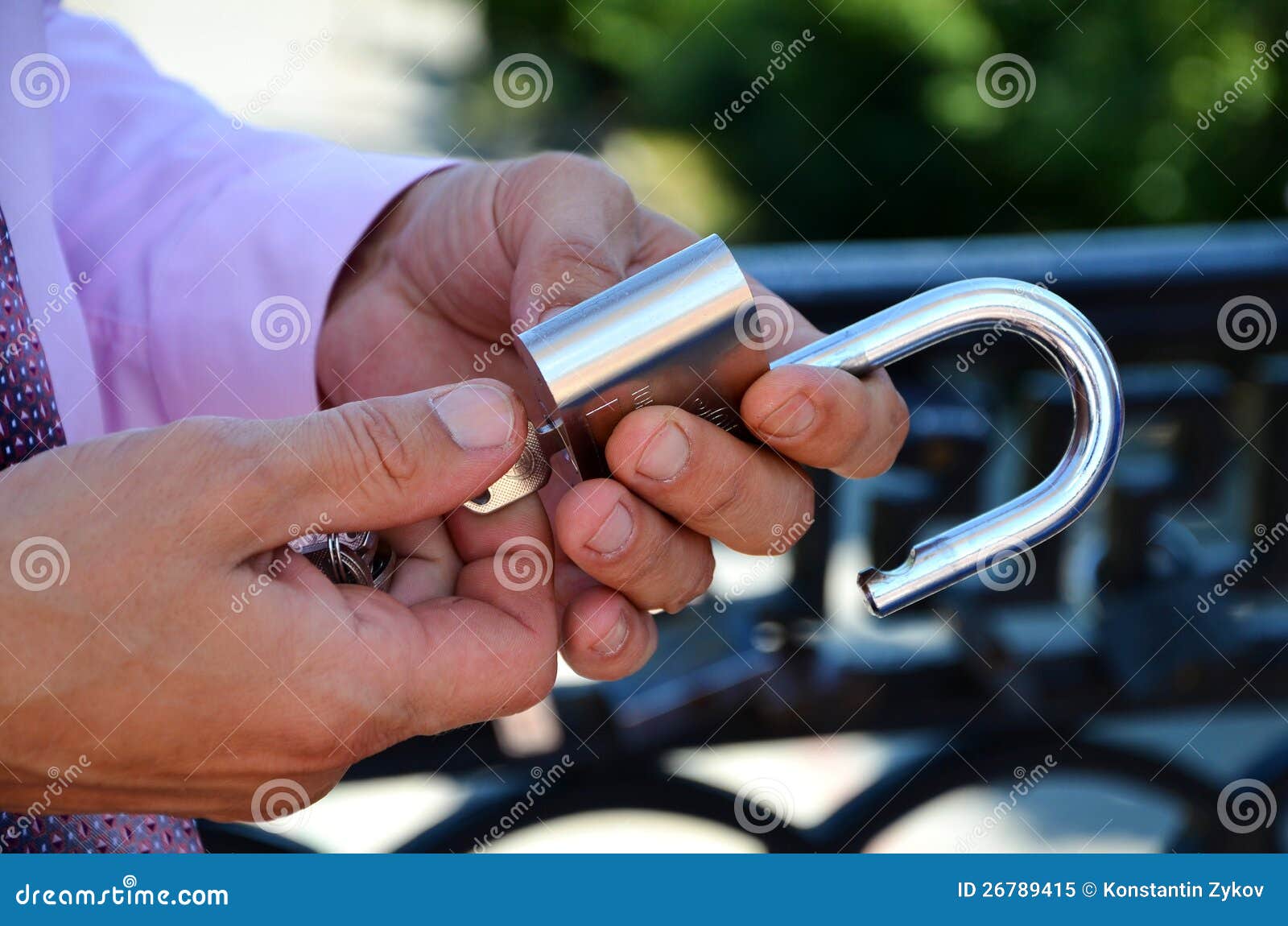 Hand opens a key lock stock image. Image of locking, metallic 26789415