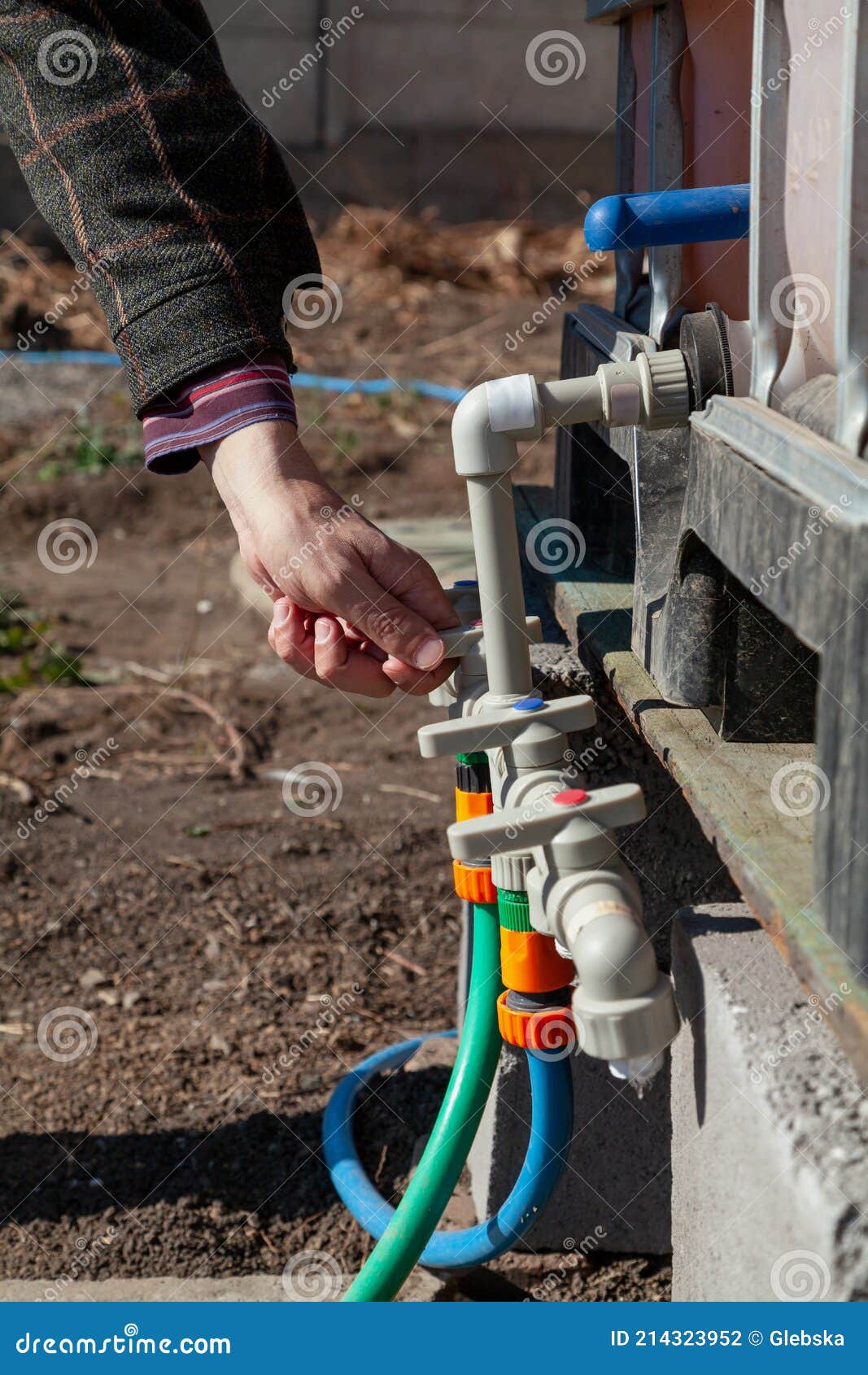 Hand Opens Tap on Plastic Irrigation System Stock Photo Image of container, agriculture 214323952