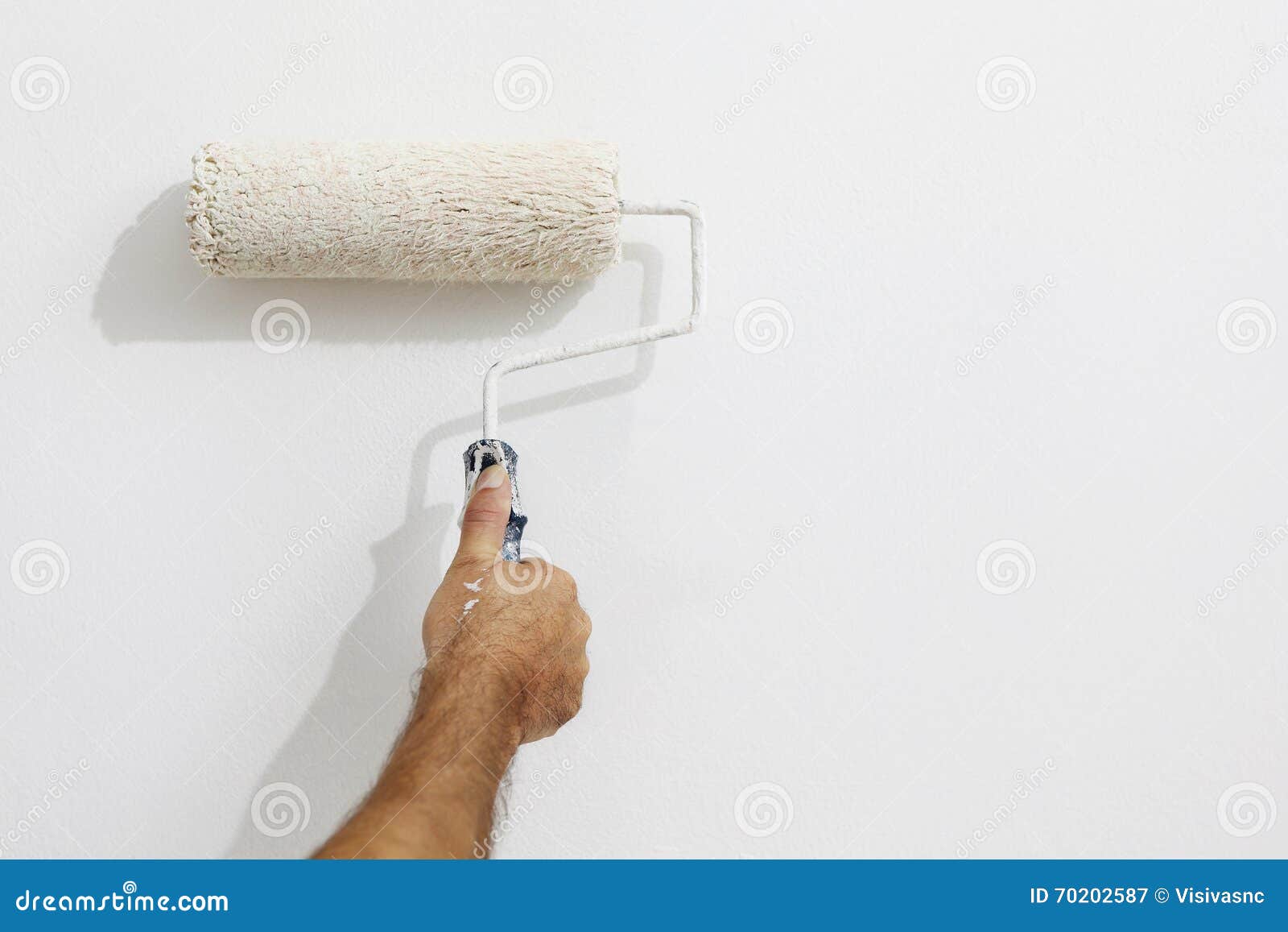 Hand Painter Man at Work with a Paint Roller, Wall Painting Stock Image