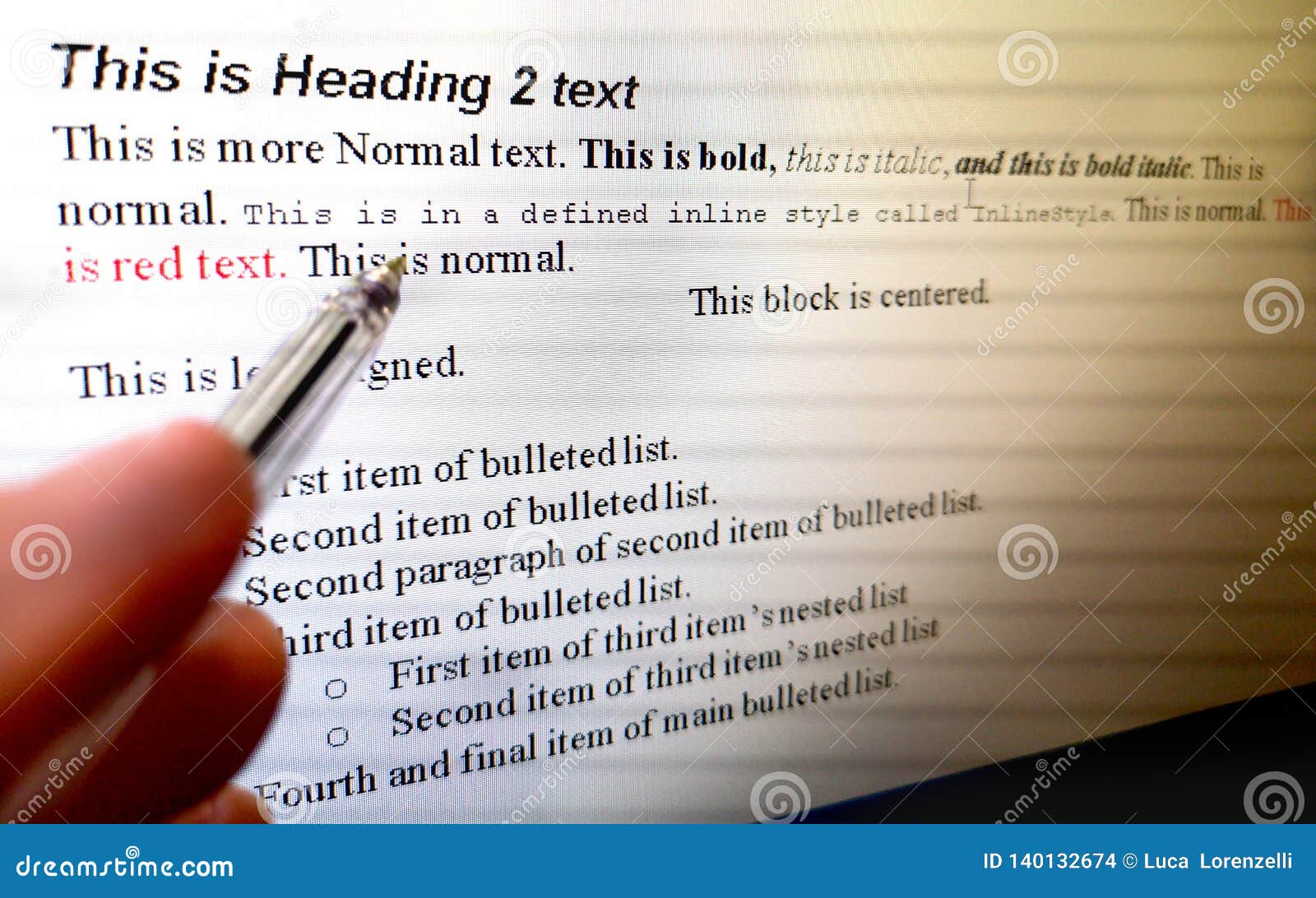 hand with pen indicate text formatting rules on word processor software on computer screen