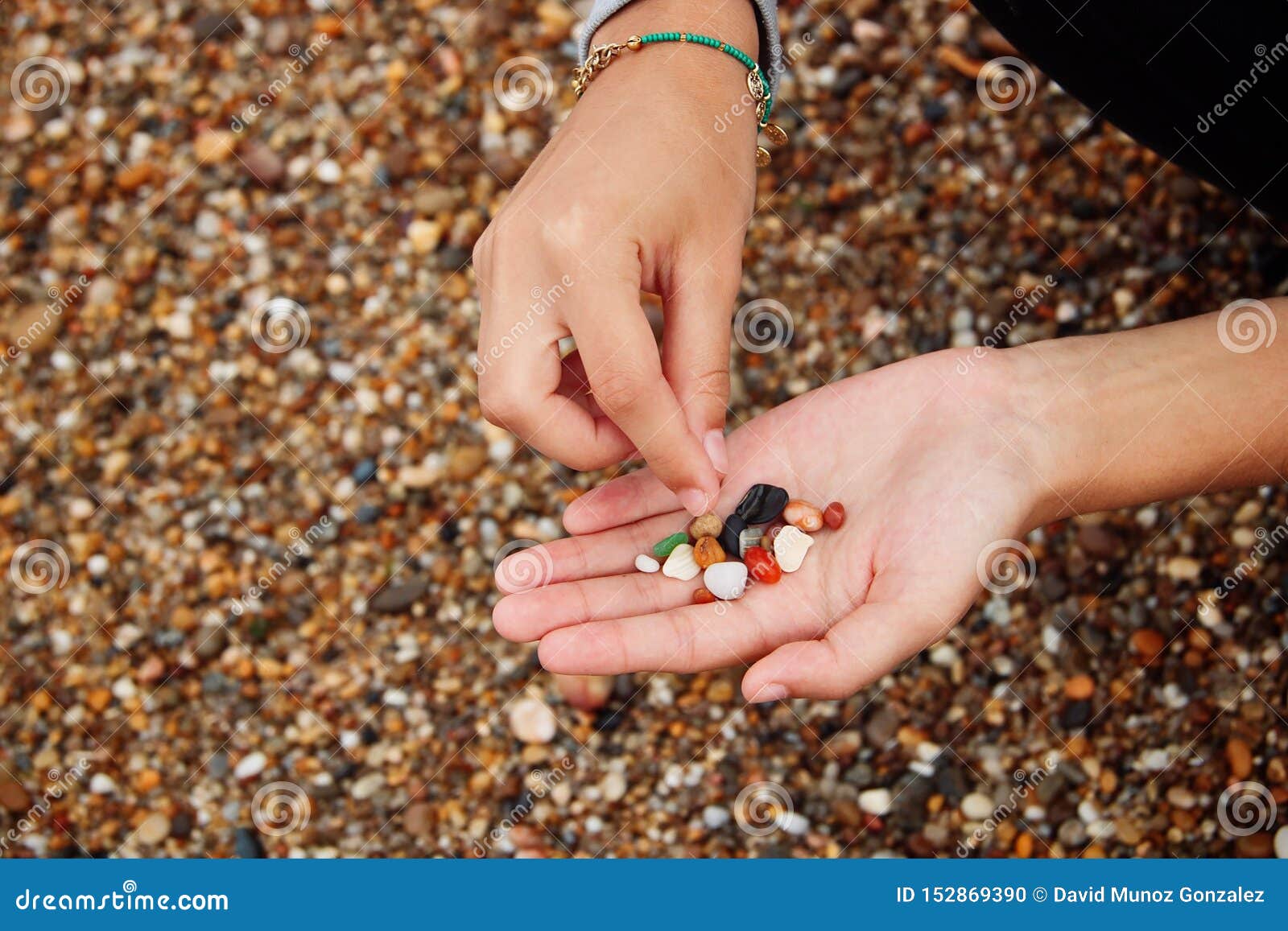 Hand picking some stones. stock photo. Image of healthcare 152869390