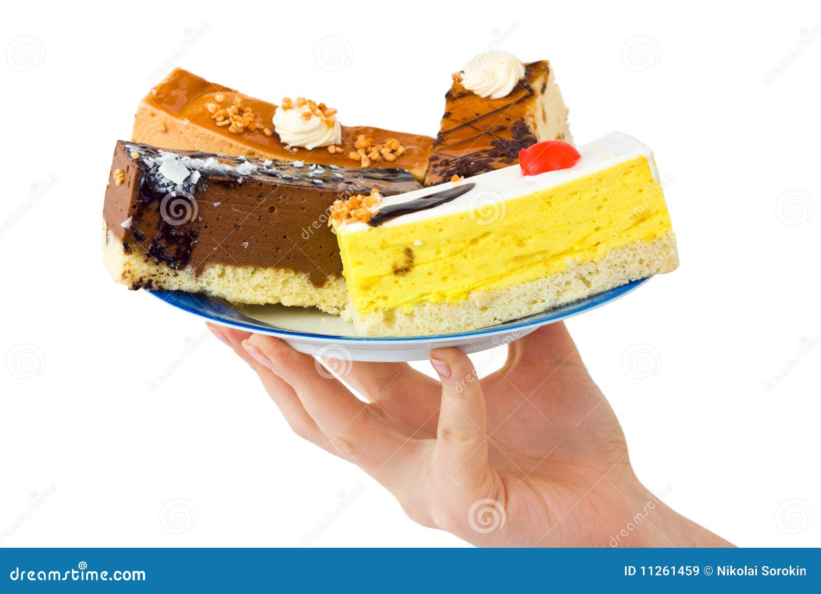 Hand and plate with cakes stock image. Image of blue 11261459