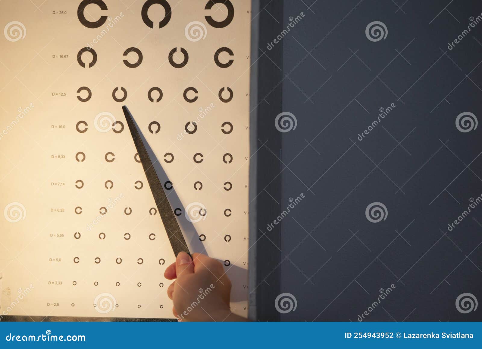 A Hand with a Pointer, an Eye Chart that Can Be Used To Measure Visual Eye Chart Used To Measure Visual Acuity
