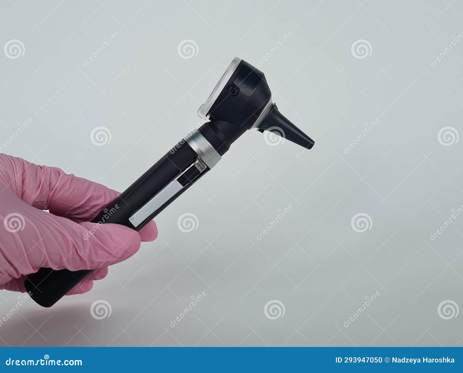 Hand pulling out otoscope stock photo. Image of exam 293947050