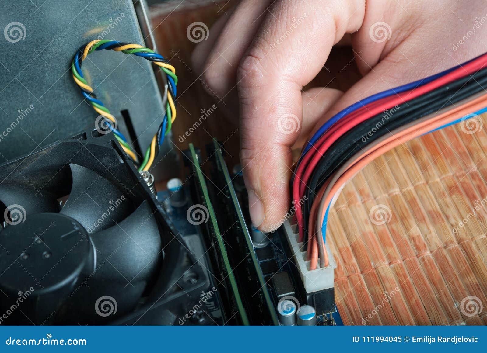 Hand Connecting Power Cable To Computer Motherboard Technology Concept Image Stock Image