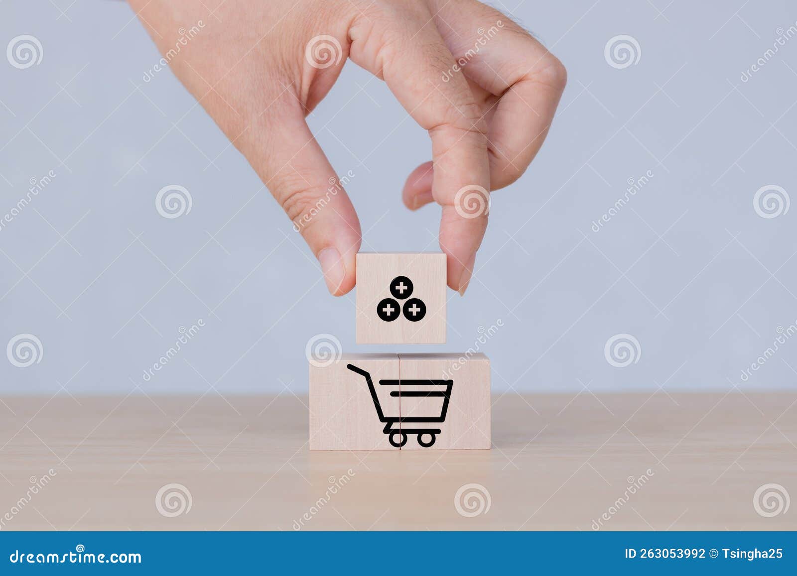 hand puts the wooden cubes with sales growth on grey background. growth of sales, average order value aov concept. sales target