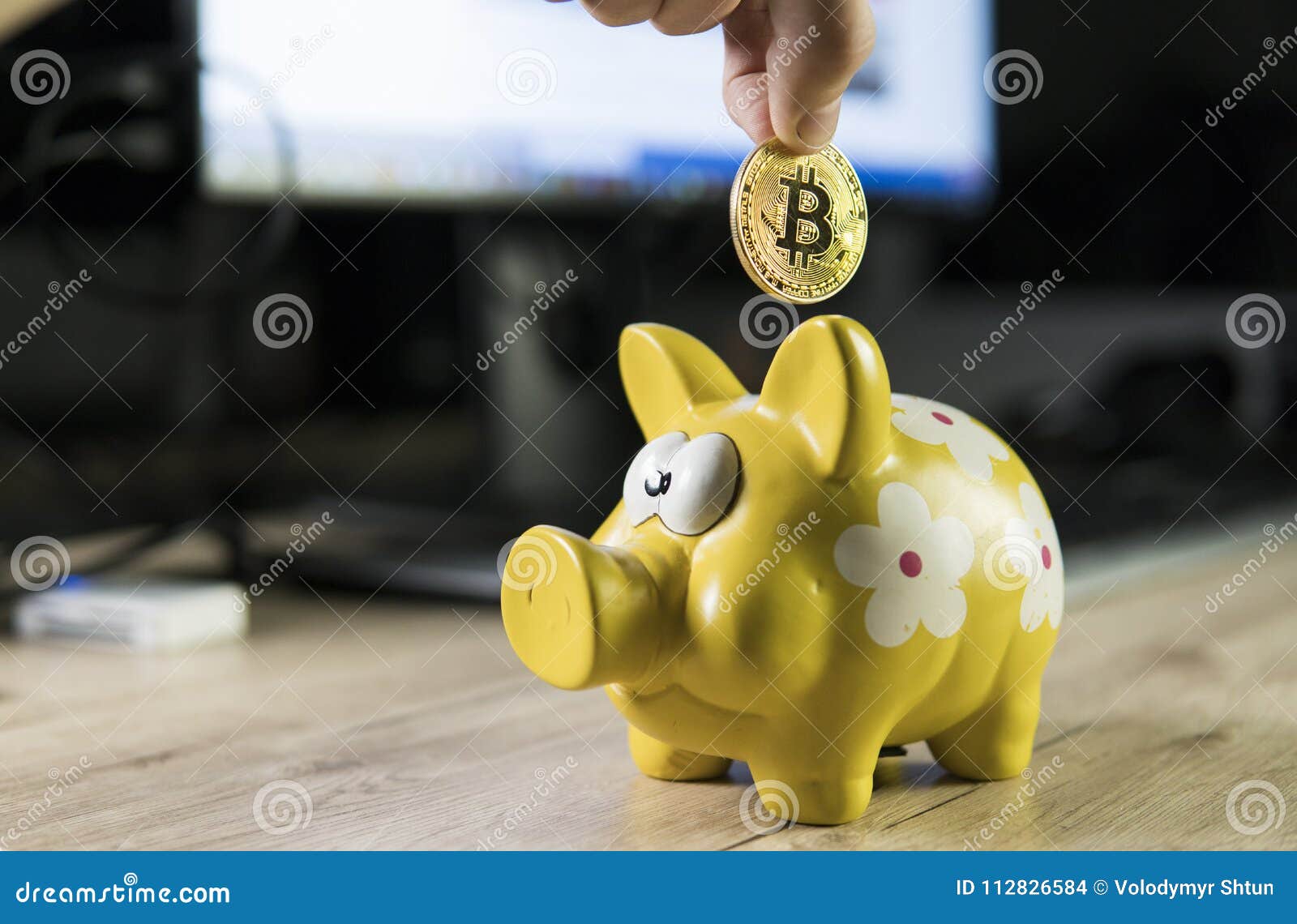 Hand Putting Golden Bitcoin In To Piggy Bank Money Box With A - 