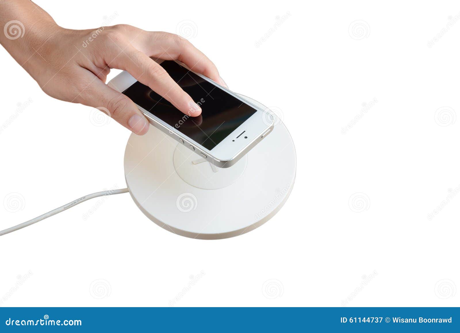 hand putting mobile phone on wireless charger, modern equipment,