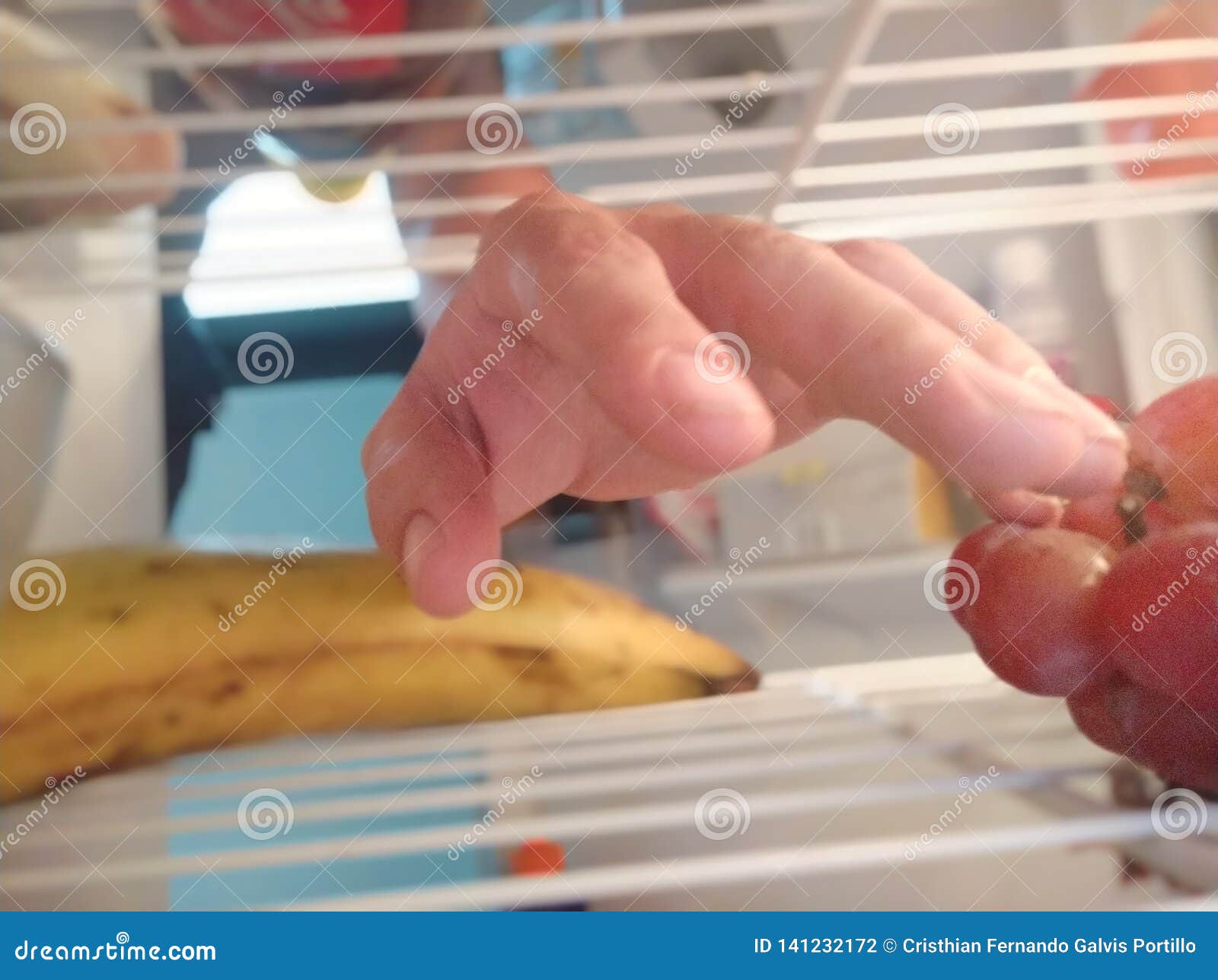 hand in the refrigerator food vegetables