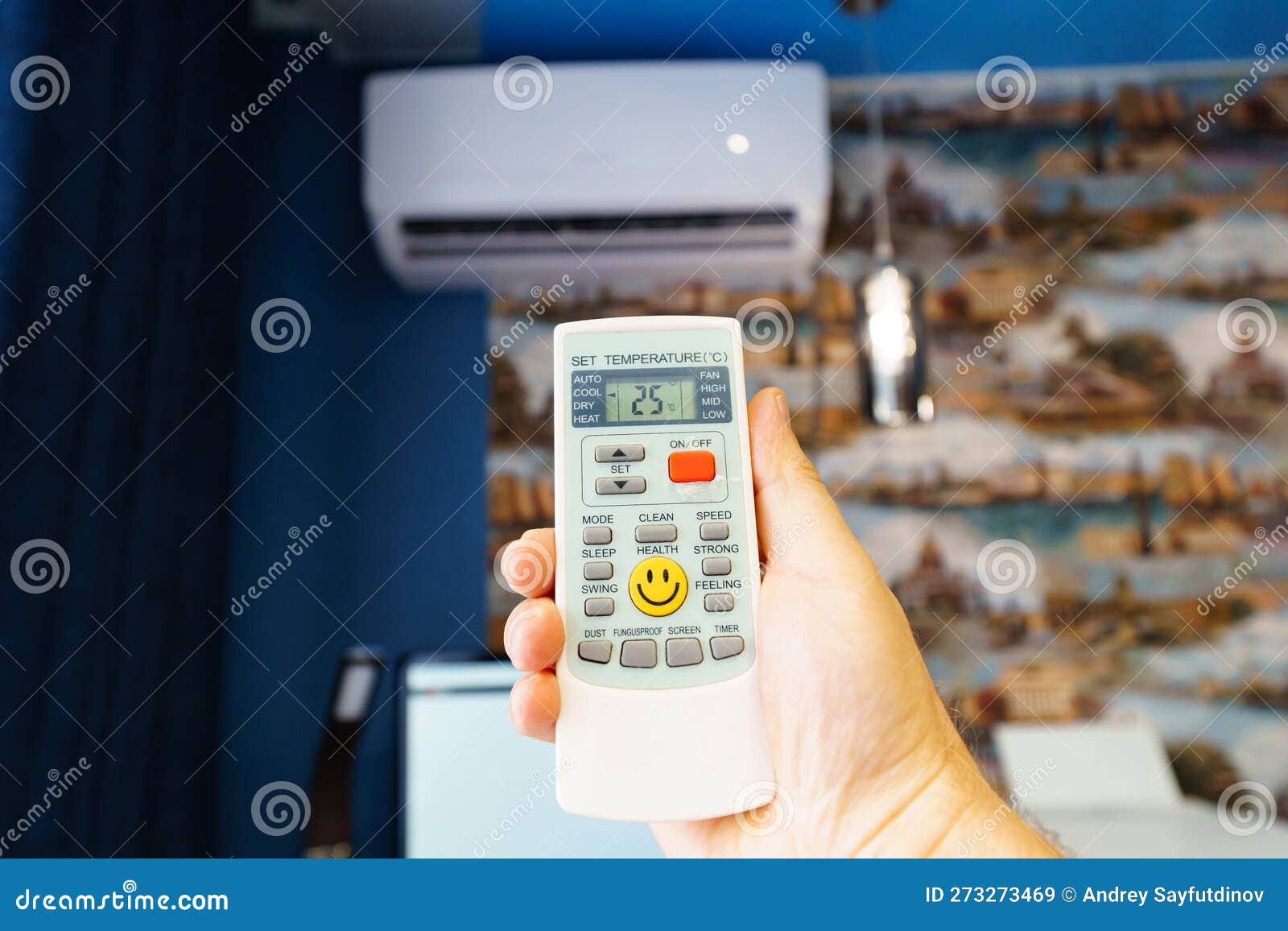 Hand with the Remote Control of the Air Conditioner. Stock Image