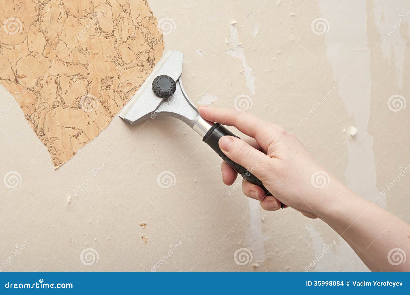 Hand removing wallpaper stock photo. Image of redecorate 35998084