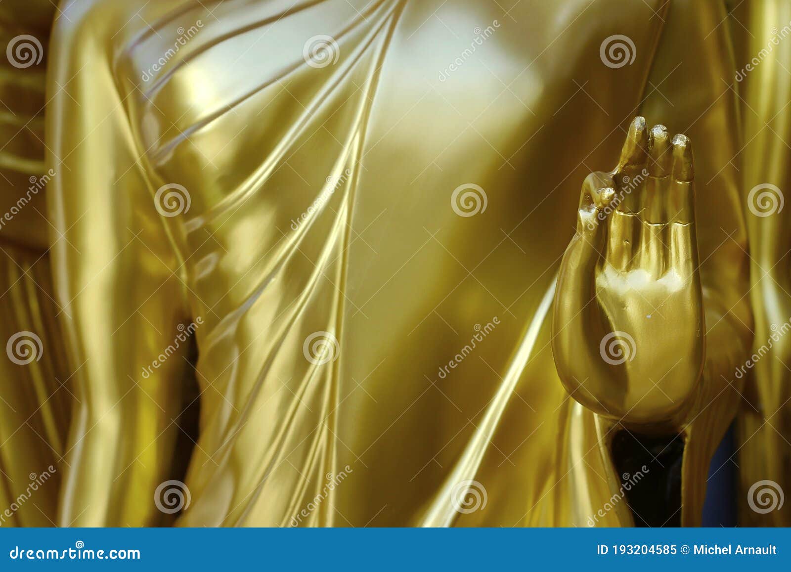 hand `s detail of statue of buddha, in buddhist temple