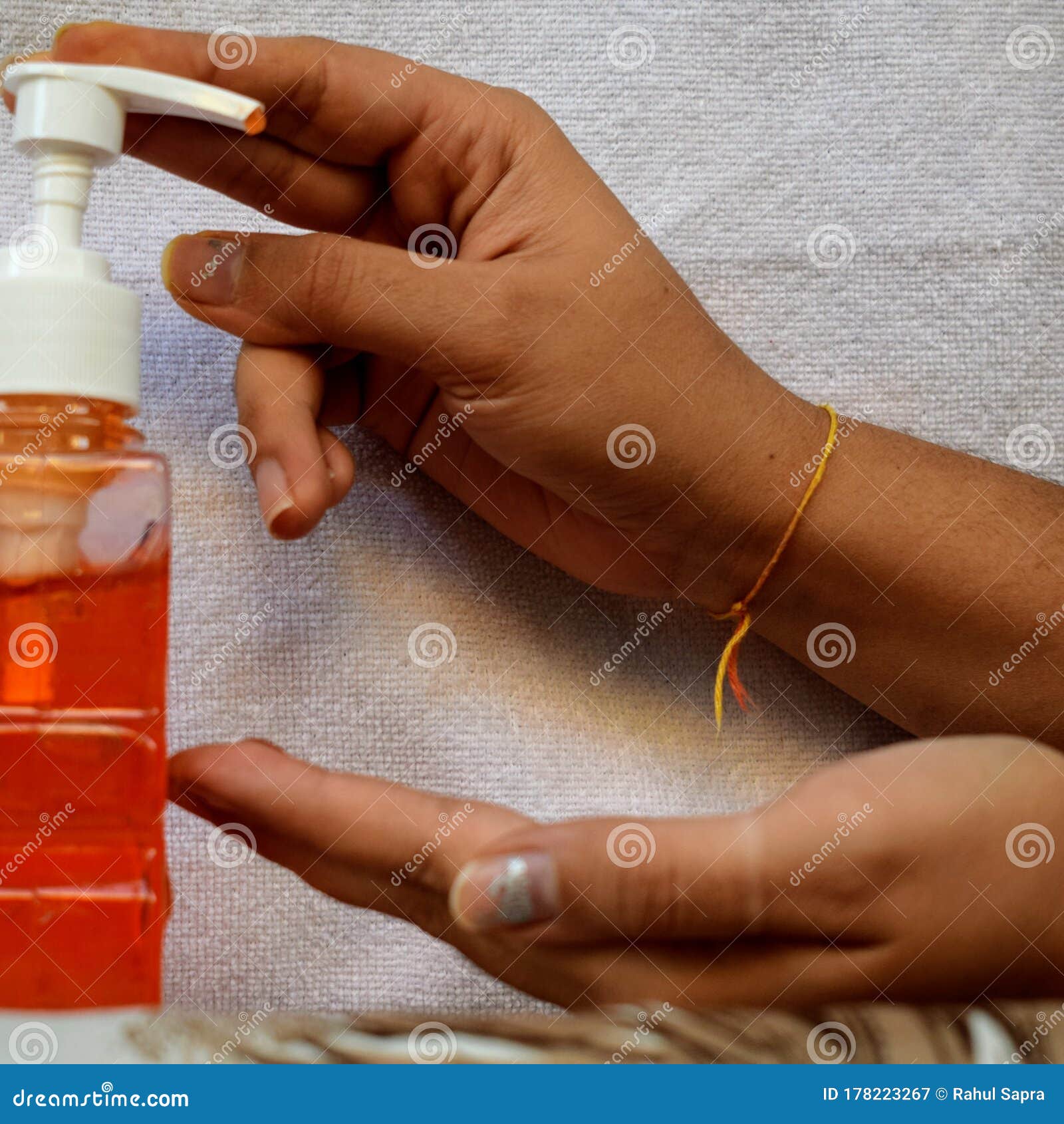 hand sanitizer alcohol gel rub clean hands hygiene prevention of coronavirus virus outbreak. man using bottle of sanitizer